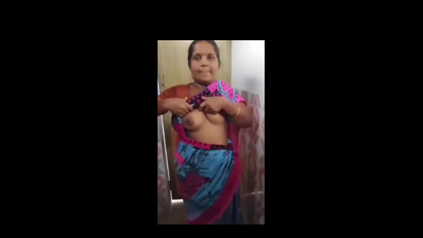 Desi Village aunty showing boobs nd sucking in bathroom